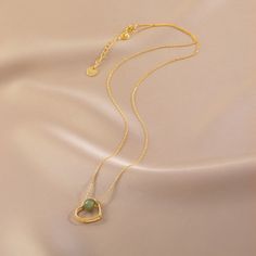 This heart-shaped pendent with jade necklace, featuring a jade bead a beautiful green color and the gold heart design has a lovely shine. If you're looking for something special, this necklace is sure to be a conversation starter. Plus, it's a timeless piece that you can enjoy for years to come. Specifications: Color: Gold Material: Silver Plated, Copper, Hetian jade Length: 15.74" + 1.96" Heart Theme, Goth Accessories, Color Heart, Hetian Jade, Golden Heart, Jade Necklace, Jade Jewelry, Copper Necklace, Jade Beads