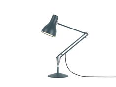 a desk lamp on a white background with a black cord attached to the end of it