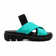 a pair of black and turquoise sandals on a white background