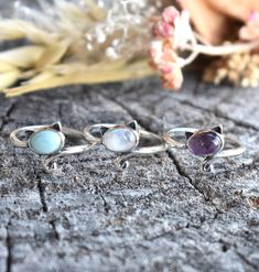 Cat Ring Details:-Choice of Natural Rainbow Moonstone, Dominican Larimar, or Natural Amethyst- 12mm face height- 2mm smooth round band- .925 solid sterling silver- Available in US ring sizes 4-10.5 with 1/2 sizes. 💜Connect with us on Instagram @a_wild_violet for sales and giveaways!**All items are in stock and ship within 2-5 business days from received payment (excluding Saturday/Sunday) from the US. If you are within the US please expect 3-7 business days for shipping transit and delivery. In Silver Stackable Rings With Natural Stones, Sterling Silver Stackable Rings With Natural Stones, Dainty Round Gemstones For Jewelry Making, Round Dainty Gemstones For Jewelry Making, Spiritual Round Larimar Jewelry, Dainty Moonstone Ring With Natural Stones, Spiritual Style Stackable Rings With Natural Stones, Dainty Round Moonstone Ring With Natural Stones, Purple Moonstone Round Jewelry