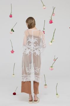 Description: Introducing our exclusive 100% Cotton See-Through Embroidered Lace Kimono Cardigan, a masterpiece of fashion designed for the modern woman. This one-size, elegantly crafted cardigan is the epitome of grace and sophistication, featuring a delicate see-through embroidered lace that offers a glimpse of your ensemble underneath. Its front tie closure adds a touch of whimsy and versatility, allowing you to style it in multiple ways to suit your mood and the occasion. Details: Size: ONE S Lace Kimono, Kimono Cardigan, Embroidered Design, Embroidered Lace, Cotton Lace, Modern Woman, The Modern, Fashion Forward, Layering