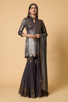 Charcoal short kurta in color block pattern metallic sequin embroidery. Comes with coordinating gharara and sheeted two tone dupatta. - Aza Fashions Elegant Fitted Sharara With Gota Work, Georgette Sharara With Sheer Dupatta For Diwali, Party Wear Chinon Sharara, Sequin Georgette Sharara For Navratri, Navratri Sharara With Sheer Dupatta In Georgette, Elegant Sequined Sharara For Navratri, Party Sharara With Cutdana Details, Diwali Sequined Georgette Sharara, Traditional Drape Georgette Sharara With Sequins