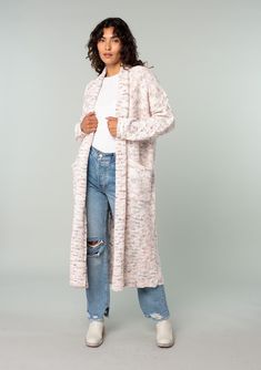 An ultra-cozy long shawl cardigan spun from a berry pink speckled knit. Speckled Oversize fit Long sleeve with cable knit accent Long duster length Shawl collar Side patch pockets Open front Cable knit accent along the back Bohemian long cardigan Laid-back and slouchy yet effortlessly polished, this ultra-soft duster cardigan is knit from a berry pink speckled yarn. Featuring classic cable knit details along the back and essential side pockets. The shawl collar adds warmth and coziness. Model is Textured Knit Cardigan For Loungewear, Spring Textured Knit Cardigan For Loungewear, Knitted Relaxed Fit Cardigan For Loungewear, Casual Cable Knit Cardigan For Loungewear, Cozy Soft Knit Outerwear For Loungewear, Relaxed Fit Knit Outerwear For Loungewear, Casual Knitted Sweater Coat For Loungewear, Casual Knitted Outerwear For Loungewear, Textured Knit Outerwear For Spring Loungewear