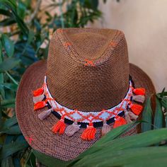 **FREE SHIPPING** One-Off, Custom/ Handpainted Fedora Hat. handpainted & decorated in a boho style. There is  an orange-white ribbon with tassels decorating the hat. 100% Paper Straw SIZE: 58-59cm *The number is the perimeter of the head expressed in centimeters (cm). To find your number (size), take a measuring tape and measure the perimeter of the head. The tape measure should be placed in the middle of the forehead and just above the ears (about 0.5 cm, above the ears). Hold the tape measure firmly, but not too tightly (Hats are not supposed to be very tight). The centimeters that you will see in the measuring tape, is also the number of the hat. (There is an example of how to measure your head in the photos). *Ready to ship Please, feel free to message me any questions you may have. I Orange Fedora Hat For The Beach, Orange Fedora Hat For Beach, Orange Fedora For Beach, Orange Bohemian Sun Hat For Summer, Bohemian Orange Sun Hat For Summer, Handmade Artisan Fedora For The Beach, Handmade Artisan Fedora For Beach, Bohemian Orange Sun Hat For Beach, Orange Bohemian Summer Hat