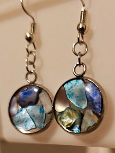 * Blue Tones Abalone Mother of Pearl Iridescent Shell Circle 16mm Silver Earrings * 16mm Silver SS Circle Cabochon. * Nickel-free. * Hypoallergenic. * Suitable for Sensitive Skin. * Lightweight. * Great gift for Christmas, Mother's Day, Birthday, Wedding, or Anniversary. * Handcrafted / Handmade Item. * Unique Gift. * Artisan Iridescent Round Jewelry With Ear Wire, Silver Round Resin Earrings, Nickel-free Iridescent Round Earrings, Iridescent Resin Round Jewelry, Blue Round Pendant Earrings For Gift, Blue Round Pendant Earrings As Gift, Nickel-free Round Resin Earrings, Iridescent Round Earrings For Gift, Iridescent Earrings Gift