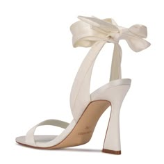 Step up your shoe game with the Nine West Kelsie dress sandal. This eye-catching style features a trendy sculpted high heel and soft textured fabric that wraps around the ankle. Trendy yet chic the Kelsie sandal will elevate any outfit. The perfect wardrobe essential! Perfect Wedding Shoes Classy, L Wedding Shoes, Block Herl Wedding Shoes, Wedding Shoes Nordstrom, Wedding Shoes For Her, Cute Shoes For Wedding Bridesmaid, Trendy Shoes Formal, Shoes For Winter Wedding Bridesmaid, Trendy Shoes For Women Formal