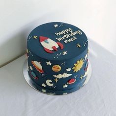 a birthday cake decorated with an outer space theme