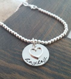 Silver Personalized Heart Bracelet, Adjustable Sterling Silver Stamped Name Bracelet, Everyday Silver Hand Stamped Name Bracelet, Everyday Personalized Sterling Silver Charm Bracelet, Engraved Sterling Silver Name Bracelet, Everyday Stamped Sterling Silver Bracelet, Silver Name Bracelet Hand Stamped For Personalized Gift, Personalized Sterling Silver Bracelet For Everyday, Hand Stamped Sterling Silver Name Bracelet For Everyday