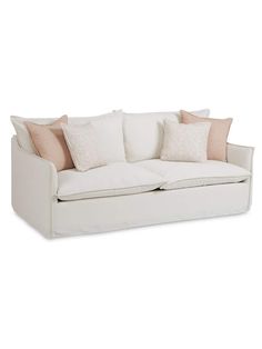 a white couch with pillows on it