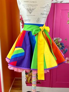 a dress made to look like a skirt with colorful ribbons on the front and bottom