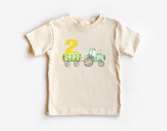 "Boy 2nd Birthday Tractor Shirt - Boy Farm Birthday Shirt - Tractor Birthday Gift - Tractor Party Shirt - Natural Shirt,Second Birthday 📣 Please check all photos for details. 📣 Use \"Add message to Seller\" link on the checkout page to send a message or important details for your order. 📣 We use Bella Canvas and Gildan when we have a shortage of stocks. 📣 Our printing method is DTF, Premium Vinyl and Heat Press. ♥ HOW TO ORDER ♥ 1- Please, Check and Review all Photos. 2- Select your shirt type, shirt size, shirt color from drop down menus and Choose your quantity. 3- Choose Your TEXT Color. Please add your text color on to the personalization box if applicable. 4- Click \"Add To Cart\". You can go back to add more product anytime you want, or you can complete the checkout process. 7- F Tractor 2nd Birthday Party, Tractor 2nd Birthday, Farm Birthday Shirt, Boy 2nd Birthday, Tractor Birthday Party, Tractor Party, Tractor Birthday, Farm Birthday, Birthday Party Shirt