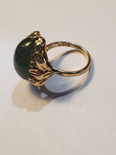 You are viewing a beautiful 14k mings green translucent jade cabochon ring. The total weight of the ring is approx.8.6 grams. The ring size approx.5 3/4 can size up or down. The ring itself measures approx.21mm x 19mm wide. Beautiful green jade translucent cabochon. Send me a message if you have any question. MAKE AN OFFER Yellow Gold Jade Cabochon Ring, Jade Rings With Polished Finish, Oval Cabochon, Jade Rings With Polished Finish In Oval Cabochon Shape, Oval Jade Rings In Yellow Gold, 14k Gold Green Gemstone Dome Ring, Jade Oval Cabochon Rings With Polished Finish, Oval Cabochon Jade Rings With Polished Finish, Gold Jade Ring With Polished Finish, Yellow Gold Jade Ring With Gemstone