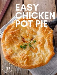 homemade chicken pot pie on a wooden table with text overlay that reads homemade chicken pot pie