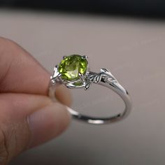 This is a gorgeous handmade creation, a combination of beauty, simplicity & Elegance. The 7*7mm round cut peridot is crafted in solid sterling silver and with rhodium plated. 14K white gold/rose gold/yellow gold available as well,pls contact me if you need. All item is sent in a beautiful gift box You can realize more lovely stuff clicking the link https://www.etsy.com/shop/knightjewelry?refshopsection_shophome_leftnav Please leave the correct address and you phone number for delivering succ Green Sterling Silver Solitaire Ring, Green Sterling Silver Rings With Prong Setting, Green Solitaire Sterling Silver Ring, Peridot Birthstone Ring In White Gold, Green Peridot Birthstone Ring With Prong Setting, Elegant Peridot Birthstone Ring With Prong Setting, Silver Peridot Jewelry For Anniversary, Green Sterling Silver Diamond Ring, Lime Green Sterling Silver Birthstone Rings