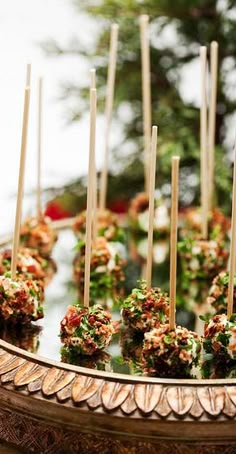 there are many food items on the plate and one is made out of cake pops