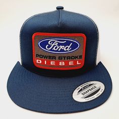 Brand New High-Quality Embroidered Patch On A Flat Bill Trucker Mesh Snapback Cap Navy Trucker Hat With Embroidered Logo, Navy Embroidered Logo Trucker Hat, Blue Trucker Hat With Embroidered Logo And Flat Bill, Blue Trucker Hat With Embroidered Patch, Blue Cap With Embroidered Patch, Blue Snapback Trucker Hat With Embroidered Patch, Blue Trucker Snapback Hat With Logo Patch, Blue Trucker Baseball Cap With Logo Patch, Blue Embroidered Snapback Trucker Hat