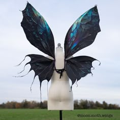 Won't arrive in time for halloween BUT -- use the discount code FRIDAY2023 to get 25% off and use it next Halloween :) Labradorite crystal fairy wings for your dark faerie costume! For more information on how to wear your Moon Moth wings, visit my website here: https://www.moonmothwings.com/pages/how-to-wear-moon-moth-wings Product Information >> Finished wings measure about 40 inches across (in wingspan). They are shaped with wire.  >> These wings are made from cotton sateen fabric. If the wing Shop Fairy Wings, Dark Faerie Costume, Moth Wings Costume, Dark Fairy Wings, Enchantix Wings, Fae Wings, Dark Fairy Costume, Dark Faerie, Faerie Wings