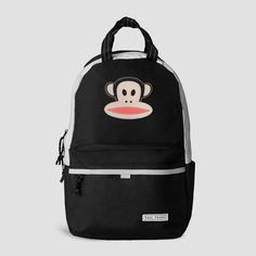 Introducing the Paul Frank Explorer Backpack, a fusion of style and functionality that takes your adventures to new heights! Embrace the spirit of the renowned Paul Frank brand, known for its playful and vibrant designs that capture hearts worldwide. This backpack features a rubber Julius patch on the top front panel, showcasing the iconic monkey that is a symbol of the brand. It also boasts a padded laptop compartment, ensuring secure storage for your tech essentials, while the front pocket int Paul Frank Backpack, Black Backpack For End Of School Year Outdoor, Paul Frank Monkey, Monkey Backpack, Explorer Backpack, Monkey Logo, Tech Essentials, Everyday Backpack, Paul Frank