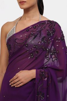 Violet saree with sequin embroidery in floral pattern crafted in satin georgette. Comes with a running blouse piece.
Components: 1
Pattern: Embroidered
Type Of Work: Sequin
Fabric: Satin Georgette
Color: Purple
Other Details: 
Note: Stitched blouse and bag shown in the image is not for sale.
Occasion: Sangeet - Aza Fashions Violet Saree, Satya Paul, Floral Saree, Sequin Embroidery, Purple Satin, Blouse For Women, Sequins Embroidery, Sequin Fabric, Blouse Online