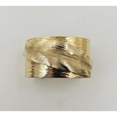 This is part of Chairish�’s Costume Jewelry assortment.  Hammered goldtone cuff bracelet with "frosted" leaf on it. Marked "Napier." Dates to 1981. An identical bracelet is shown on pg. 547 of Melinda L. Lewis & Henry Swen's book "The Napier Co.: Defining 20th Century American Costume Jewelry." Opening in bracelet; 1 1/8 inches with a little bit of flexibility. Interior circumference; 6 3/4 inches. Overall measures: 2.5 inches wide by 1.88 inches deep by 1.88 inches high. Condition: Very good; Mi American Costume, Book Pieces, Modern Branding, Costume Jewelry, Cuff Bracelet, 20th Century, Cuff Bracelets, Dates, Gold Tones