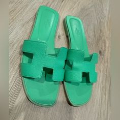 Great Condition Worn A Couple Times Size 38.5 Comes With Box And Dust Bag Modern Green Sandals With Branded Heel Counter, Luxury Green Round Toe Sandals, Luxury Green Sandals With Round Toe, Luxury Green Leather Sandals, Designer Green Flat Sandals, Designer Flat Green Sandals, Luxury Green Flat Sandals, Hermes Slides, Latest Ladies Shoes