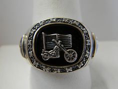 BGE Bradford Exchange 925 sterling silver black onyx diamond freedom biker ring Sz 10.5. It can be easily re-sized by a local jeweler. The ring is set with a sterling motorcycle & American flag on a polished black onyx gemstone surrounded by 14 genuine diamonds. The setting measures 7/8" by 3/4". The ring is marked BGE 925 and weighs 14.8 grams. BIN (Buy It Now) for only 79.99. Super-size pictures for close-up details. Please remember most all my items are vintage & estate found, therefore do not expect perfection, as they may show some signs of wear or imperfections only adding to the character and authenticity. I do my best to accurately describe and photograph all my items. Please message me with any questions. Thank You!. Black Biker Style Ring As Gift, Biker Style Sterling Silver Jewelry For Biker Events, Black Biker Rings For Biker Events, Silver Biker Jewelry As A Gift, Biker Rings, Bradford Exchange, Onyx Gemstone, Rings Statement, Black Onyx