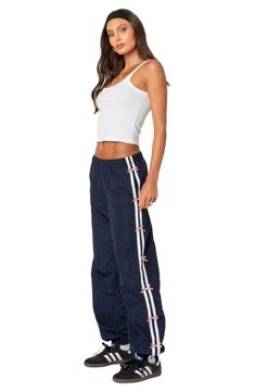 Get active in these sporty track pants designed with bow-trimmed stripes racing down the sides. Elastic waist Side-seam pockets 100% polyester Machine wash, dry flat Imported Casual Track Pants, Striped Track Pants Outfit, Adidas Track Pants Outfit, Navy Track Pants, Track Pants Outfit, Japan Outfits, Sporty Pants, Get Active, Shoe Wishlist