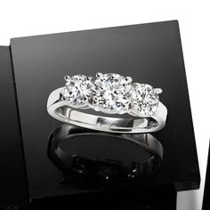 Ross-Simons - 2.00ct t. w. Lab Grown Diamond Three-Stone Ring Round Cut in 14kt White Gold. Size 8. Impeccable sparkle times three! Our exceptional three-stone ring flashes 2.00 ct. t. w. round brilliant-cut lab-grown diamonds in a high-polished 14kt white gold setting. Lab-grown diamonds are identical to mined diamonds according to their optical, physical and chemical properties. All Ross-Simons lab-grown diamond jewelry in 14kt gold and platinum includes an IGI Laboratory-Grown Diamond Report Three Stone Diamond Ring In 14k White Gold, 14k White Gold Three Stone Diamond Ring, Luxury 14k White Gold Three Stone Diamond Ring, Classic Three-stone Platinum Jewelry, Classic Three Stone Platinum Jewelry, Three Stone Platinum Round Band Jewelry, Three Stone Platinum Jewelry With Round Band, Dazzling Three Stone Diamond Ring, Classic Sterling Silver Three Stone Wedding Rings