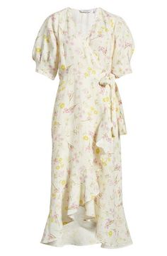 This ever-enchanting flowery midi is designed in a wrapped silhouette and accented with floaty ruffles. True wrap style with side tie closure Surplice V-neck Short sleeves Lined 100% linen Dry clean Imported