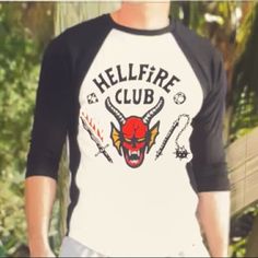 Stranger Things Hellfire Club T Shirt Punk Style White Cotton Shirt, White Long Sleeve Punk T-shirt, White Cotton Punk Shirt, Edgy White Crew Neck Shirt, White Punk Style Fan Merchandise Top, Edgy White T-shirt With Logo Print, Stranger Things Hellfire Club, Stranger Things Hellfire, Hellfire Club