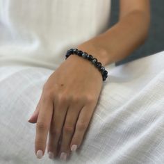 This elegant bracelet is made with exquisite snowflake black obsidian, a rare and precious stone that is believed to have spiritual meaning. The snowflake obsidian used in this bracelet is of the highest quality, and it has been carefully hand-selected to ensure its beauty and perfection. The unique pattern of the snowflakes is said to represent the infinite wisdom of the universe, and it is said to be used as a powerful talisman for protection and good luck in many ancient cultures.

&nbsp; Elegant Black Hematite Crystal Bracelet, Black Agate Beaded Bracelet With Natural Stones, Black Agate Beaded Bracelets With Natural Stones, Black Agate Bracelets For Healing, Elegant Black Hematite Bracelets, Black Obsidian Gemstone Beaded Bracelets, Black Agate Crystal Bracelet With 8mm Beads, Black Agate Bracelet With 8mm Beads, Black Agate Crystal Bracelet With Gemstone Beads