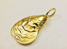 This vermeil sea shell charm is nice for necklaces, bracelets and earrings. It measures about 25x14mm.It is 18k gold plated over 925 sterling silver (vermeil),shiny gold. 1PC silver version: Listing: http://www.etsy.com/listing/150799765/925-sterling-silver-oxidized-sea-shell MATTE VERMEIL VERSION: Listing: http://www.etsy.com/listing/155241261/vermeil18k-gold-over-925-sterling-silver For the larger quantity convo us. Thanks for stopping by! Elegant Gold Shell As Gift, Elegant Handmade Gold Shell, Gold Shell With Pearl Charm As Gift, Gold Shell With Pearl Pendant, Gold Shell With Pearl Charm For Gift, Elegant Gold Shell With Pearl Charm, Silver Shark, Silver Sea, Oyster Shells