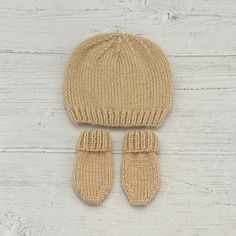 This adorable hat and mittens gift set for newborns is the perfect addition to any little one's wardrobe.Handmade with soft and cosy acrylic yarn in gender neutral beige, this set is perfect for both baby girls and baby boys. Keep your little one warm and stylish with this charming set.Handcrafted with love, this set also makes a wonderful, thoughtful gift for expecting parents. This gift set is available in two sizes: Newborn -to fit a head circumference of  approx 13 inches. 0-3 months-to fit Cream Beanie Hat As Gift, Cream Winter Hat As Gift, Baby Hat And Mittens, Knitted Baby Hat, Gifts For Expecting Parents, Expecting Parents, Baby Hats Knitting, Knitted Baby, Neutral Beige