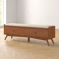 a wooden bench sitting on top of a hard wood floor next to an open window