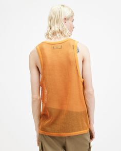 We see right through the Anderson Vest - it's mesh. Made from organic cotton and shaped to a relaxed fit. It has a scoop neck with a jersey trim - perfect for sunny days.  This vest is designed to a relaxed fit that is true to size Pullover Scoop neck Sleeveless Open mesh fabric Single jersey trim neckband Flatlock stitch at the hem Sporty Crew Neck Vest For Spring, Spring Sporty Crew Neck Vest, Sporty Summer Vest Top, Casual Summer Tank Mesh Top, Casual Spring Mesh Tank Top, Scoop Neck Summer Vest For Everyday Use, Summer Mesh Crew Neck Top, Summer Mesh Top With Crew Neck, Summer Mesh Tank Top