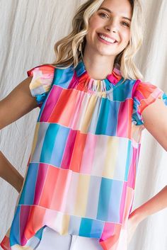 Super fun, bright and colorful summer blouse. Rainbow colors. Flutter capped sleeve. Keyhole button on back of neck. Sheer fabric, fully lined. 100% Polyester. Runs larger, small fits sizes 4-6, medium 8-10 and large 12-14. Playful Short Sleeve Blouse, Multicolor Short Sleeve Tops For Summer, Trendy Summer Short Sleeve Top With Flutter Sleeves, Trendy Flutter Sleeve Top For Summer, Trendy Short Sleeve Top With Flutter Sleeve For Summer, Multicolor Rainbow Print Tops For Spring, Multicolor Short Sleeve Tops For Vacation, Summer Vacation Blouse With Butterfly Sleeves, Spring Multicolor Ruffled Tops