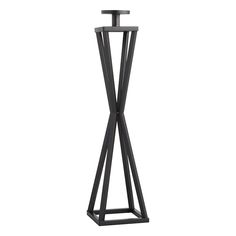 a black metal stand with a candle on it