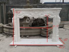 a white fireplace surround with measurements for the top and bottom part in front of it