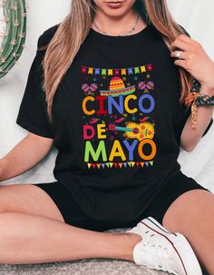 🎉 Get ready to fiesta in style with our vibrant Cinco De Mayo t-shirt! Made with ultra-soft Bella Canvas fabric, this shirt ensures both comfort and quality. Featuring a festive design inspired by the celebration of Mexican heritage and culture, it's the perfect attire for parties, gatherings, or simply showing off your love for the holiday. Whether you're sipping margaritas or indulging in delicious tacos, this shirt is sure to add a dash of flair to your festivities. Grab yours now and let th Pre-shrunk Short Sleeve T-shirt For Cinco De Mayo, Cinco De Mayo Graphic Tee With Short Sleeves, Cinco De Mayo Graphic T-shirt, Black Crew Neck T-shirt For Cinco De Mayo, Casual Multicolor Shirt For Cinco De Mayo, Cinco De Mayo Funny Print Crew Neck T-shirt, Cinco De Mayo Graphic Print T-shirt, Casual Cinco De Mayo T-shirt With Funny Print, Casual T-shirt With Funny Print For Cinco De Mayo