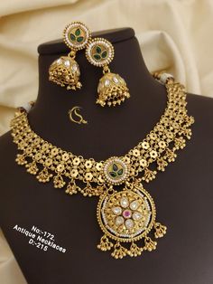 Description :- Indian Choker Necklace and Earrings Set, High Gold Choker Set For Women Wedding Gift Gift yourself a royal look with this perfectly crafted kundan necklace set from Manalisstudio. Crafted with high quality kundan stones and pearls, it is impressive in design. The green enamel artwork adds perfect texture to the design. Perfect for weddings and festivities, this antique necklace set should be put on with your favorite sari or lehenga. 100% Satisfaction. Long Lasting Plating, High-Q Indian Gold Choker, Gold Choker Necklace Set, South Indian Necklace, Gold Choker Set, Choker Sets, Indian Choker, Indian Choker Necklace, Indian Wedding Jewelry Sets, Bridal Choker