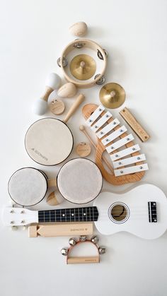 an assortment of musical instruments on a white background