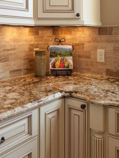 an image of a kitchen with white cabinets and granite counter tops on pinterest