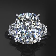 an oval diamond ring with three pear shaped diamonds