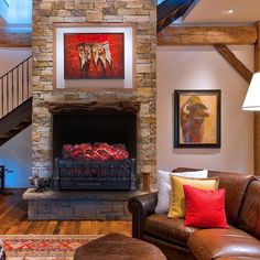 a living room filled with furniture and a fire place