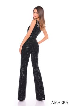 Be a trendsetter in this sequined one shoulder jumpsuit by Amarra 88136. Crafted with meticulous attention to detail, this one-shoulder jumpsuit features a fitted bodice that accentuates your curves, while a subtle cinch at the waist adds definition and flair. With flared-leg pants that elongate the silhouette, this ensemble promises to turn heads wherever you go. Adorned with delicate sequins, it adds a touch of shimmer and sparkle to your look, ensuring you shine bright at any occasion. Linear Elegant Sequined Jumpsuits And Rompers For Party, Elegant Jumpsuits And Rompers With Contrast Sequin For Party, Elegant Evening Jumpsuits And Rompers With Contrast Sequin, Glamorous Strapless Jumpsuit For Prom, Elegant Strapless Sequin Jumpsuit For Night Out, Elegant Strapless Jumpsuit With Sequins For Night Out, Glamorous One-shoulder Jumpsuit For Party Season, Glamorous Formal Sequin Jumpsuits And Rompers, Glamorous Formal Jumpsuits And Rompers With Sequins