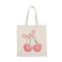 a pink bag with two cherries on it