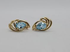 You are viewing a beautiful 14k solid gold topaz earrings. Pierced styleback. The total weight of the earrings approx.3.08 grams. Each earrings measures approx.17mm x 1mm wide. Marked 14k at the back. The earrings is in good condition. Blue Topaz Fine Jewelry Earrings For Formal Occasions, Anniversary Yellow Gold Blue Topaz Earrings, Anniversary Yellow Gold Earrings With Blue Topaz, Modern Yellow Gold Jewelry With Blue Topaz, Yellow Gold Earrings With Blue Topaz Gemstone, Modern Yellow Gold Blue Topaz Jewelry, Fine Jewelry Topaz Birthstone Earrings, Yellow Gold Blue Topaz Earrings For Gift, Fine Jewelry Birthstone Earrings In Topaz