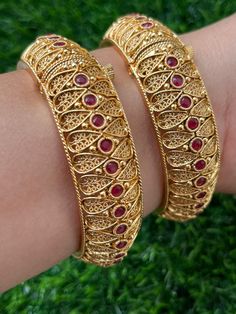 Polki Gold Plated Ruby Kundan Bangle Kada Festive Bangle Cuff Bracelet, Bohemian Festival Bracelets, Adjustable Temple Bangle Bracelet, Adjustable Temple Jewelry Bangle Bracelets, Adjustable Bangle Bracelets In Temple Style, Hand Set Bangle For Festivals, Bohemian Tilla Bangle Bracelet, Heavy Metal Bracelet For Festival, Heavy Metal Bracelets For Festival