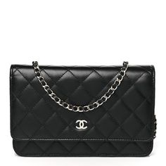 This is an authentic CHANEL Lambskin Quilted Wallet On Chain WOC in Black. This wallet is crafted of textured diamond quilted lambskin leather in black. This shoulder bag features a polished silver chain-link crossbody strap and a Chanel CC logo on the facing flap. The bag opens to a burgundy fabric interior with a zipper compartment, card slots, and a leather patch pocket. Burgundy Fabric, Quilted Wallet, Wallet On Chain, Diamond Quilt, Cc Logo, Leather Patches, Lambskin Leather, Crossbody Strap, Chain Link