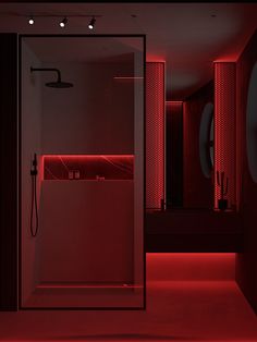 a bathroom with red lighting in the shower